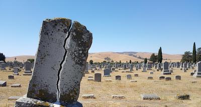 Professional headstone cleaning service at a cemetery in California