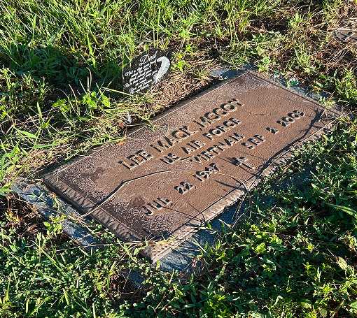 Corroded bronze memorial plaque before professional restoration