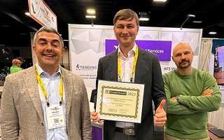 Artem Manilov holding the 2026 ICCFA Innovation Award for grave care