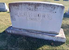 Weathered and faded epitaph on E.G. Moore's gravestone before professional repainting