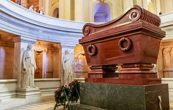 The massive red quartzite sarcophagus of Napoleon Bonaparte at Les Invalides in Paris