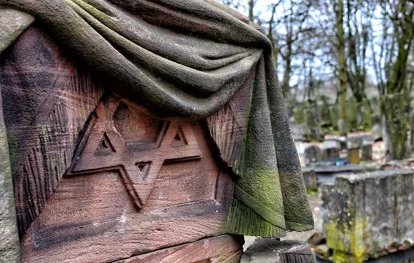 A Jewish headstone deeply engraved with the Star of David