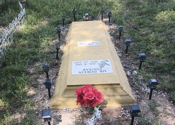 Cleaned, repainted letters, and added photo plaque for a flat granite veteran headstone in North Carolina / After